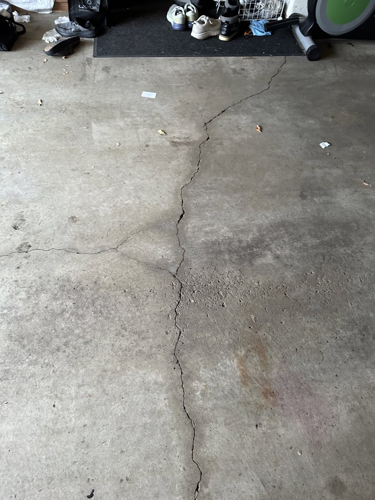 Two car garage concrete floor repair or replacement.